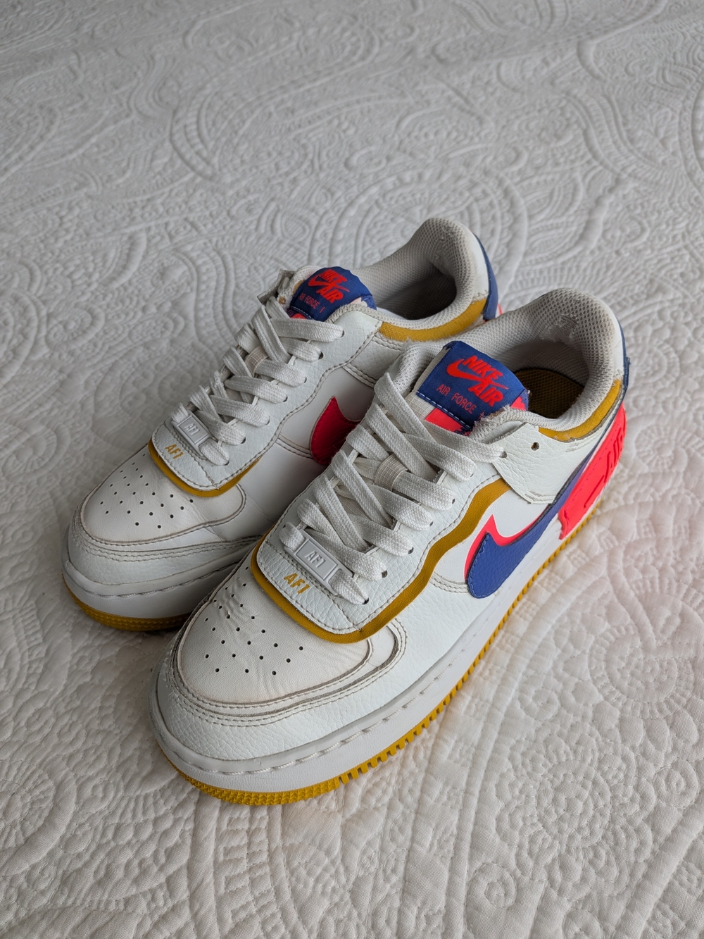 Nike White Leather Sneakers with Blue Swoosh and Orange Trim